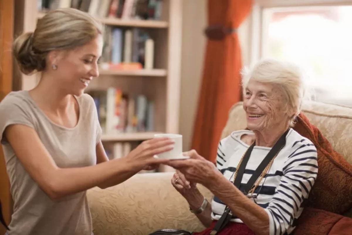Care Assistant And Coffee - Corridor Crossing