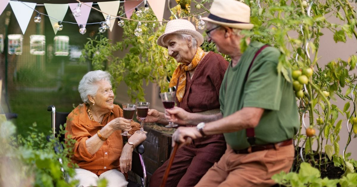 Seniors Gardering In Residential Care Home